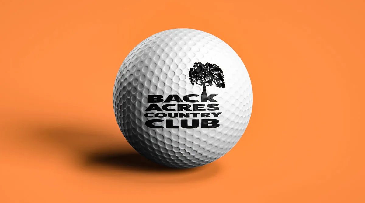 Golf ball printed with the Back Acres Country Club logo on an orange background