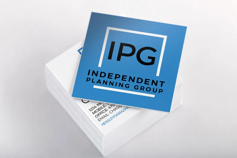 Stack of square IPG business cards with the blue logo