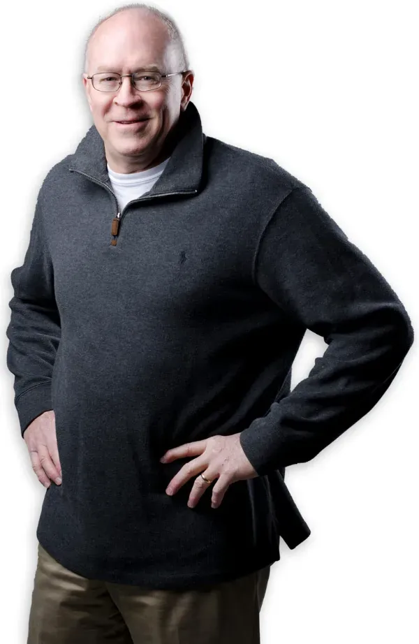 Billy Myers in a casual quarter-zip sweater, smiling