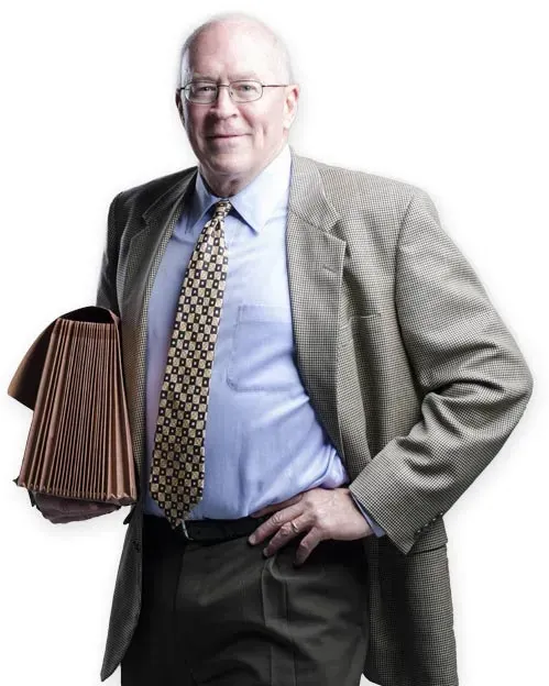 Attorney Billy Myers in a tweed jacket holding a legal file
