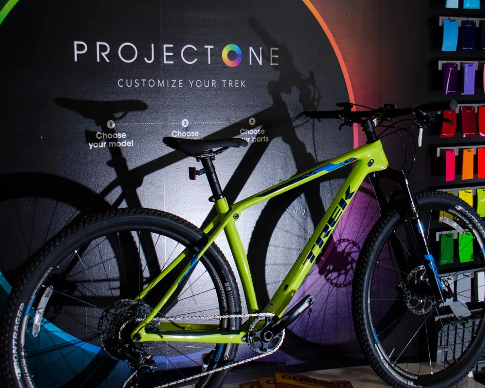 Mountain bike on display in front of a custom paint wall